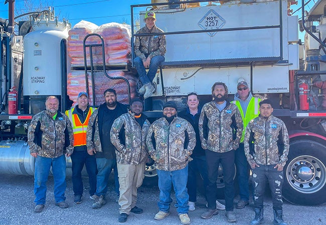 Kevin Lowe, a PPG employee within our Traffic Solutions business, with his colleagues