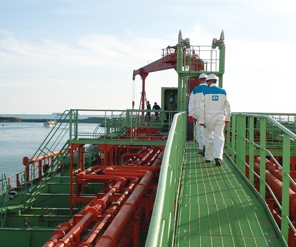 A group of men walking on a ship