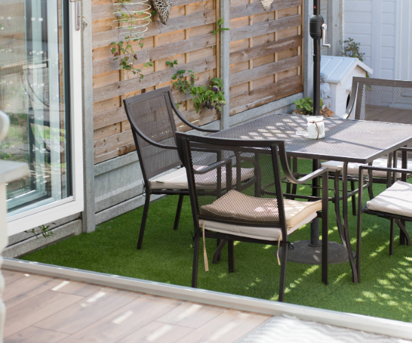 Black metal patio furniture set outside of a home