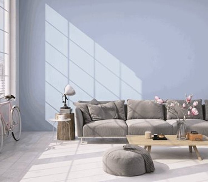 A living room with a bicycle and a couch