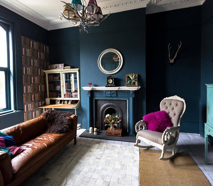 A room with a fireplace and a couch