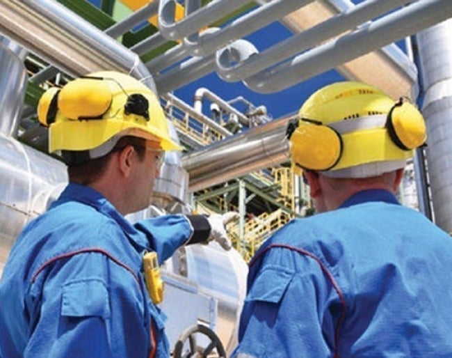 Men wearing hard hats and helmets