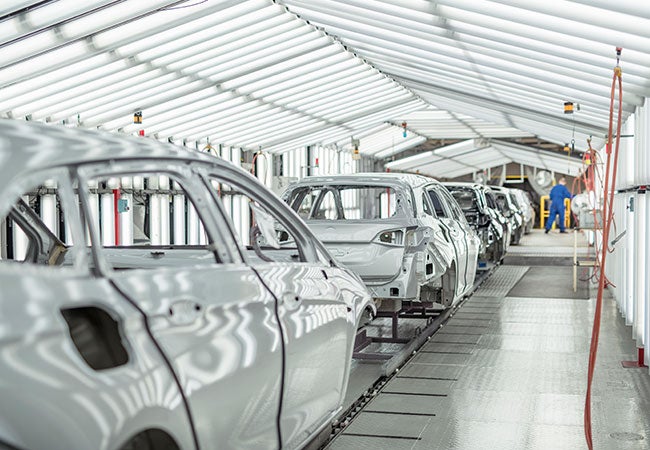 Line of cars in assembly plant