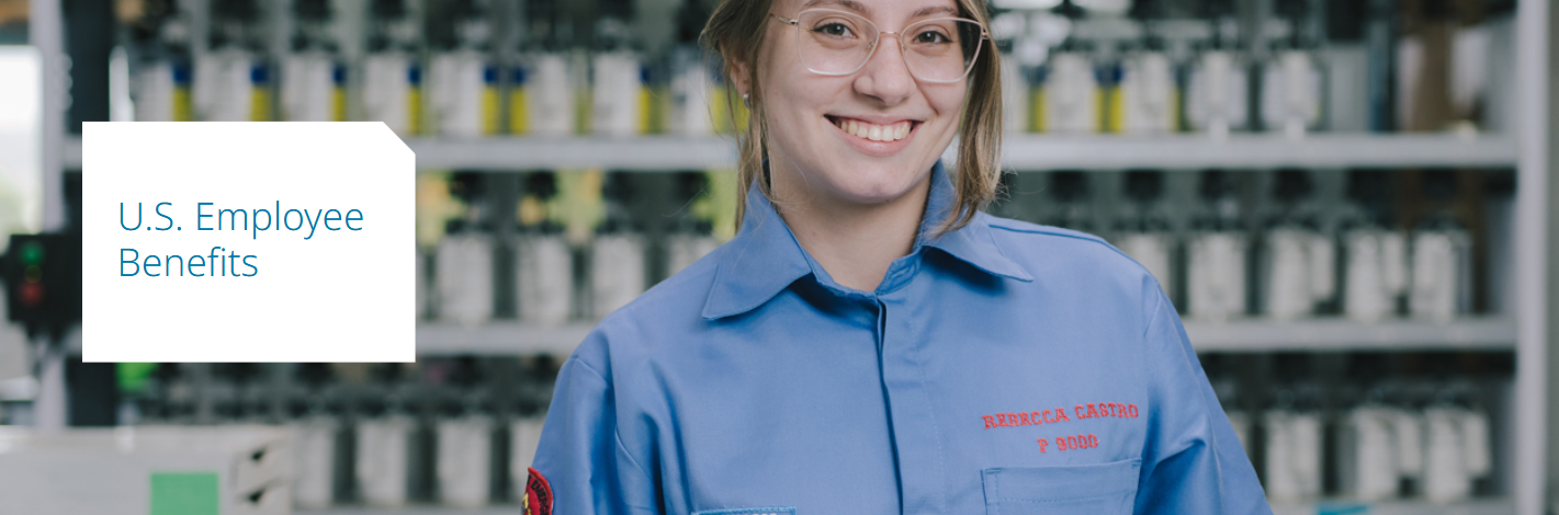 A woman wearing glasses and a blue shirt