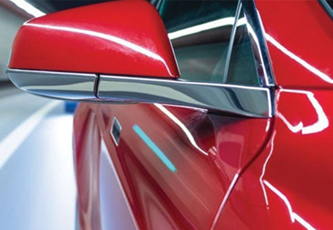 Portion of a car coated in red