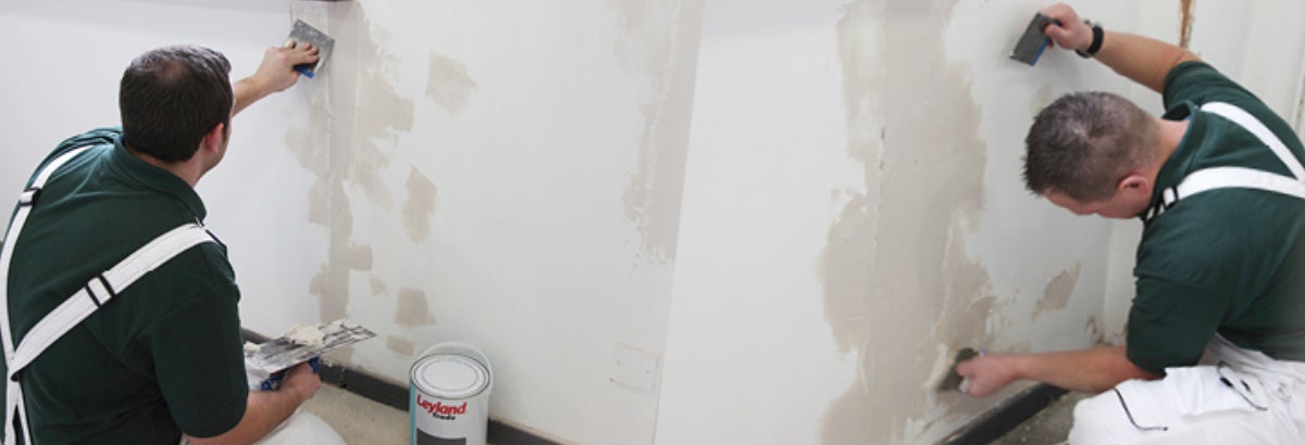 A paint can next to a wall