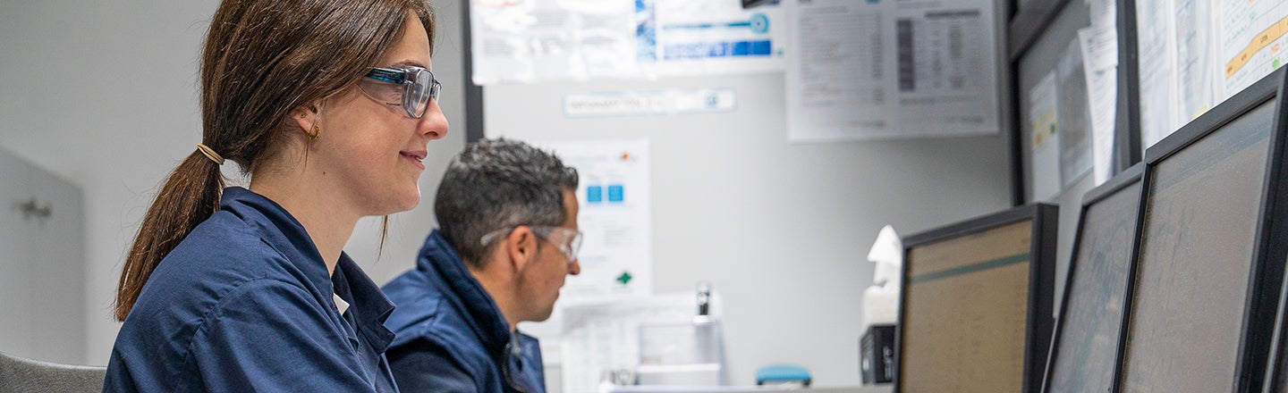 Male and female colleagues working on computers
