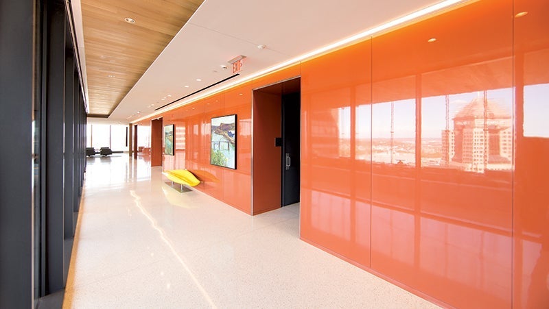 Internal hallway in PNC Plaza with glossy orange walls using PPG's Manor Hall paint.