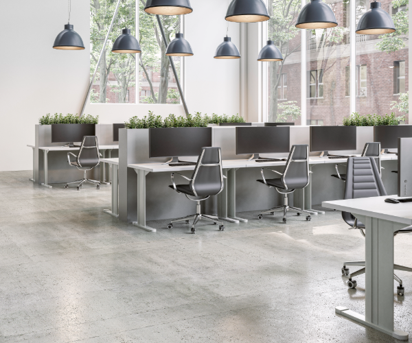 Open office space featuring gray and black metal office furniture, computers and interior lights