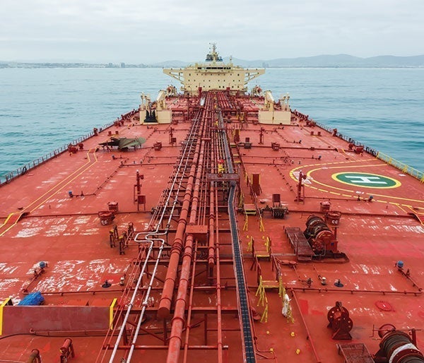 A large red ship in the water
