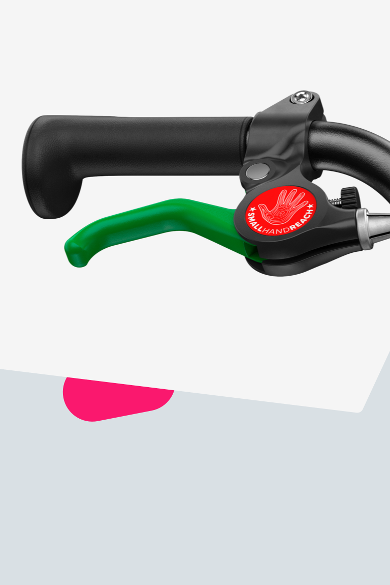 Zoom sur le levier de frein vert actionnant le frein arrière des vélos woom GO