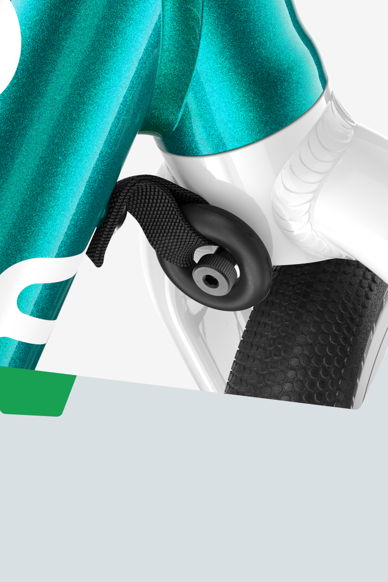 Close-up of the steering limiter on a turquoise woom GO balance bike