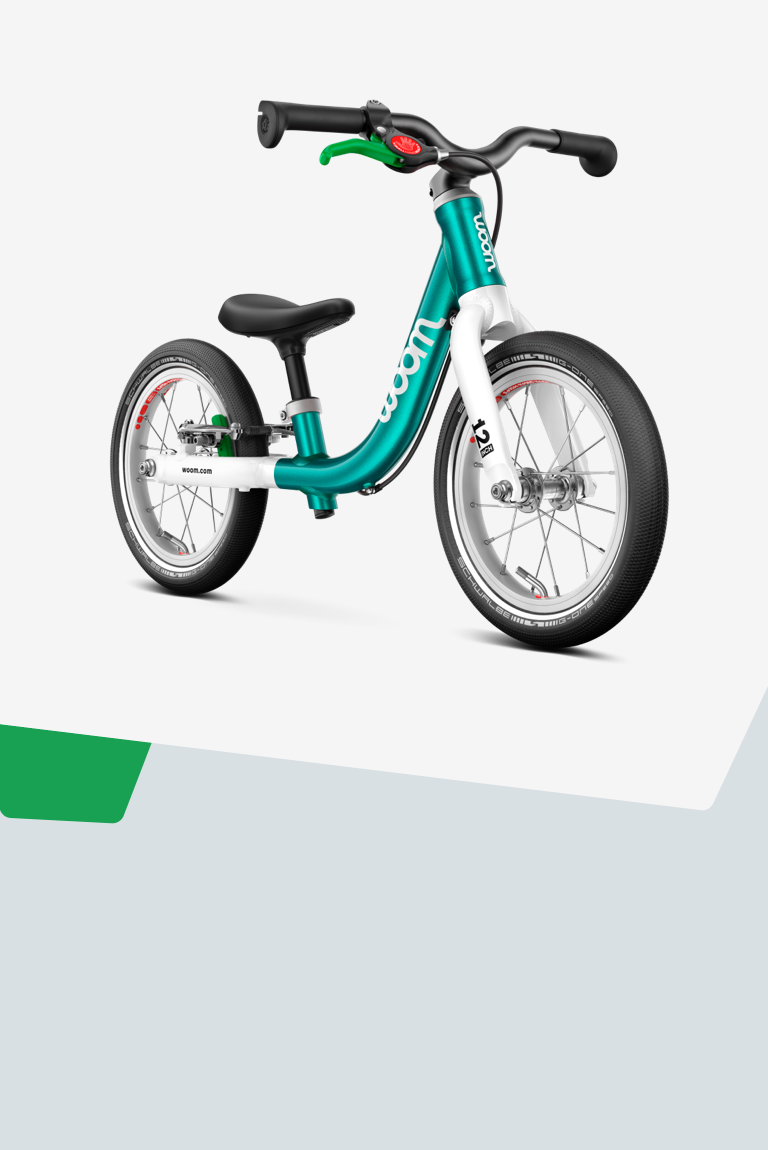 A turquoise woom GO 1 12" balance bike for kids aged 18 months-plus, viewed from the side.