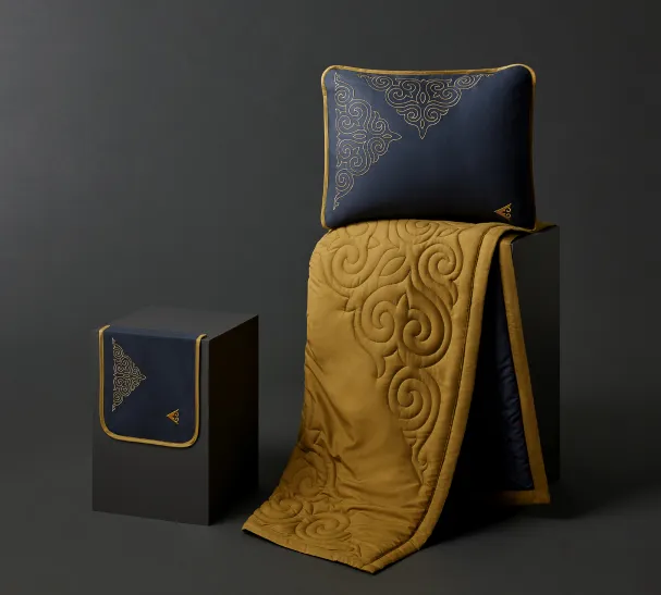 A pillow and blanket of Air Astana amenity on a box