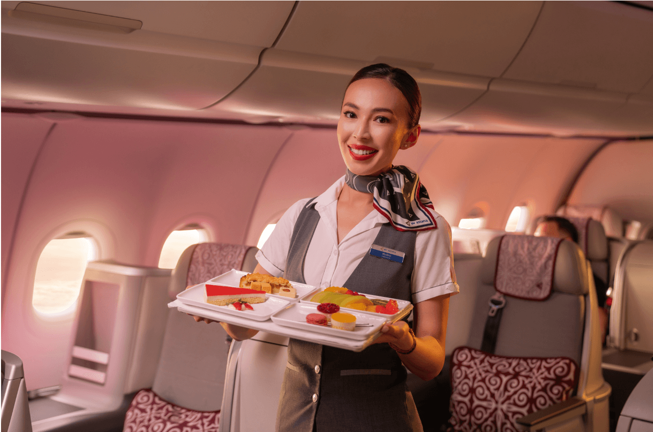 A woman holding a tray of food