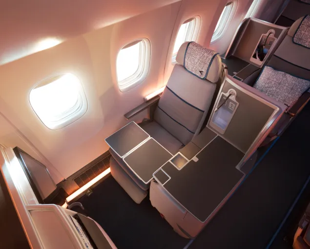 A seat and table in an airplane