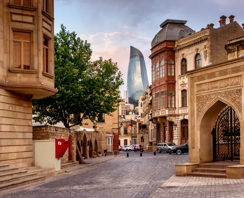 A city with tall buildings and a body of water