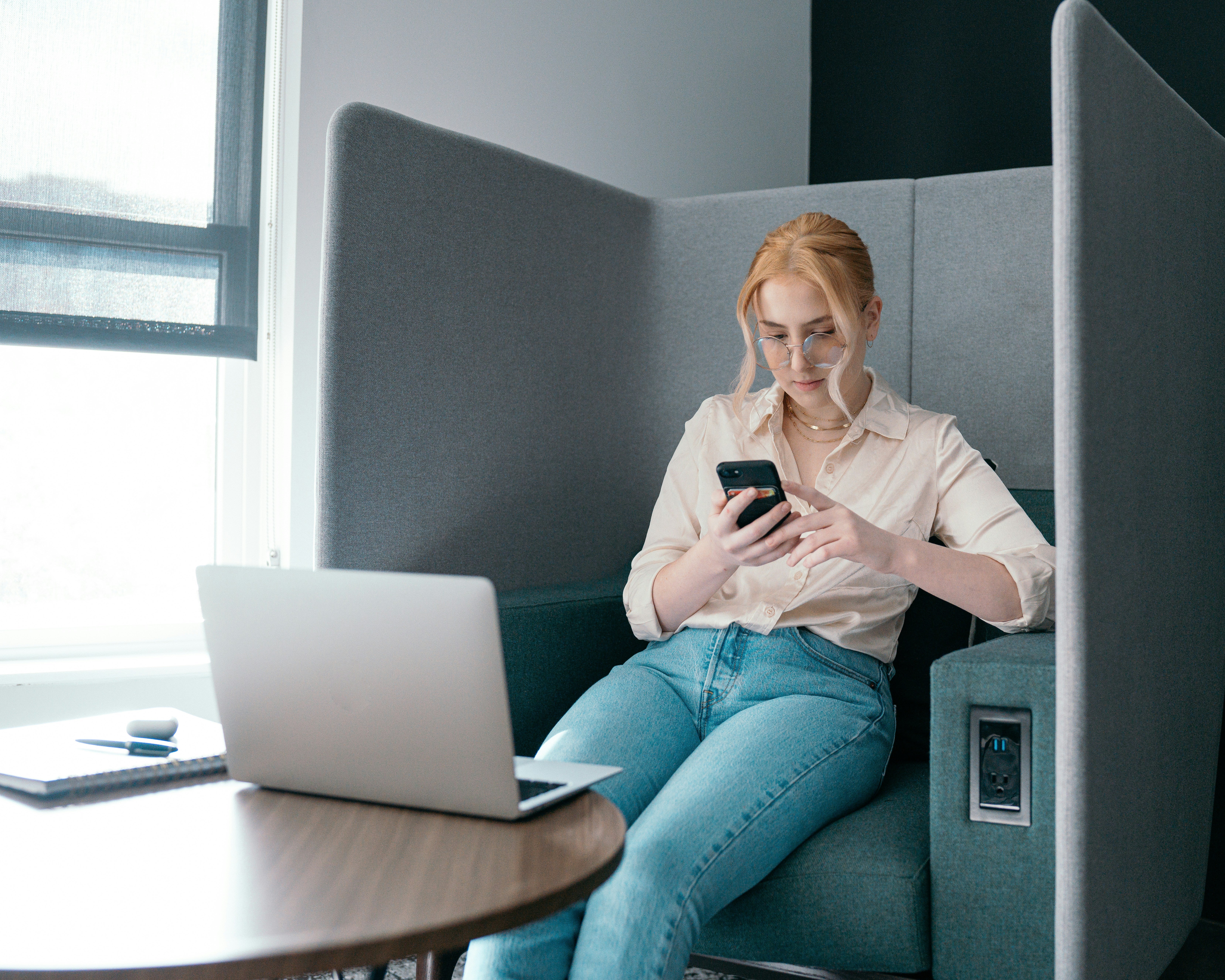 Person reading phone at work