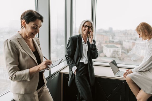 A group of women standing in a meeting room