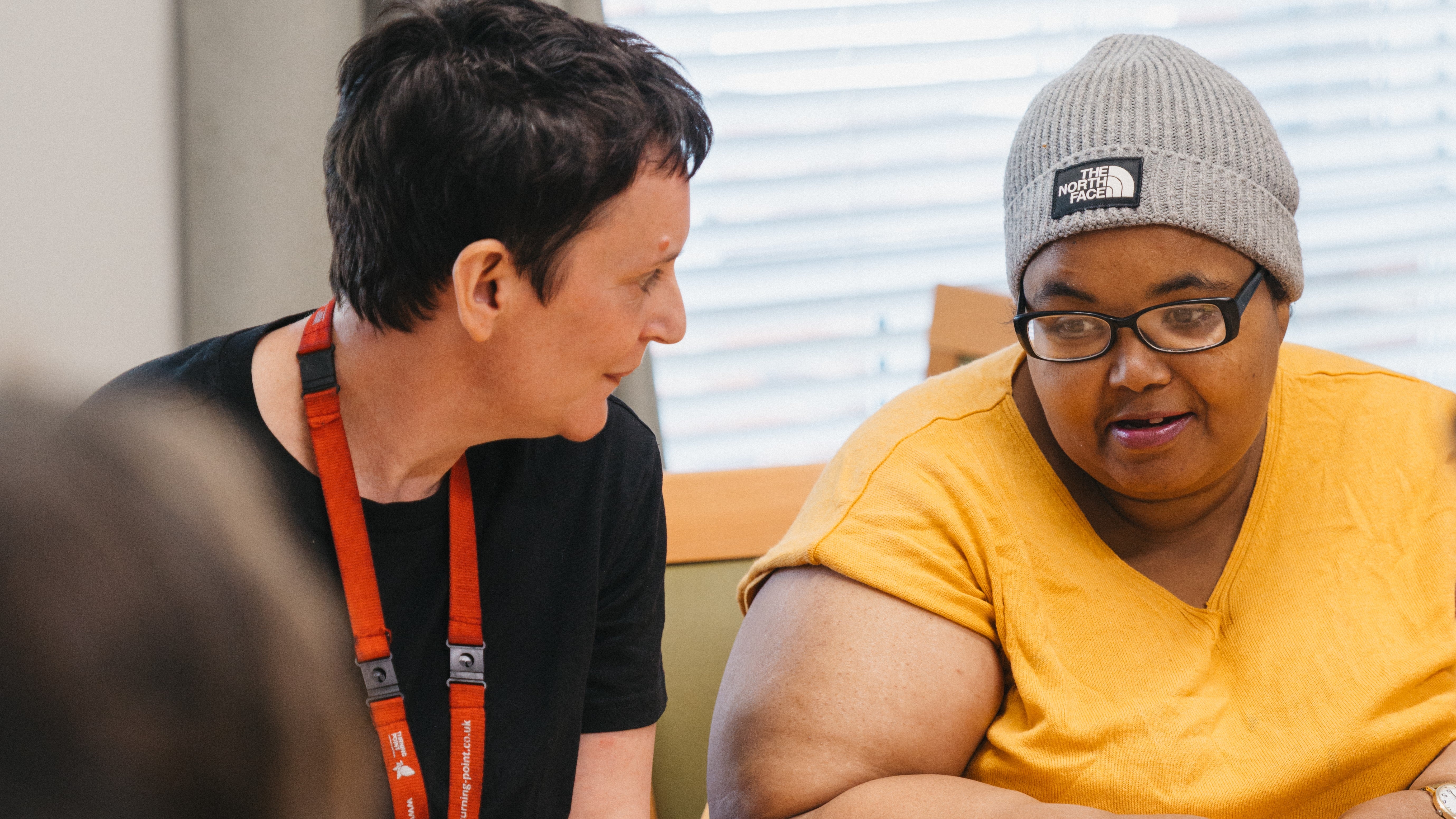 A woman looking at another woman