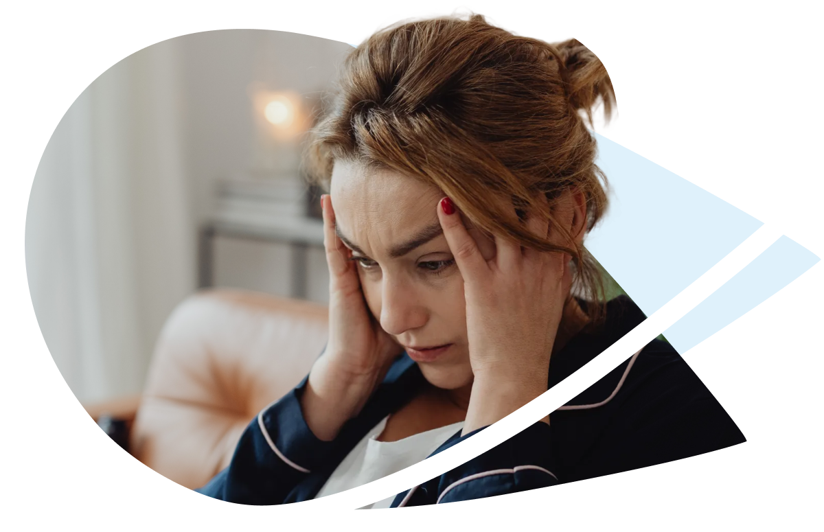 A woman holding her head