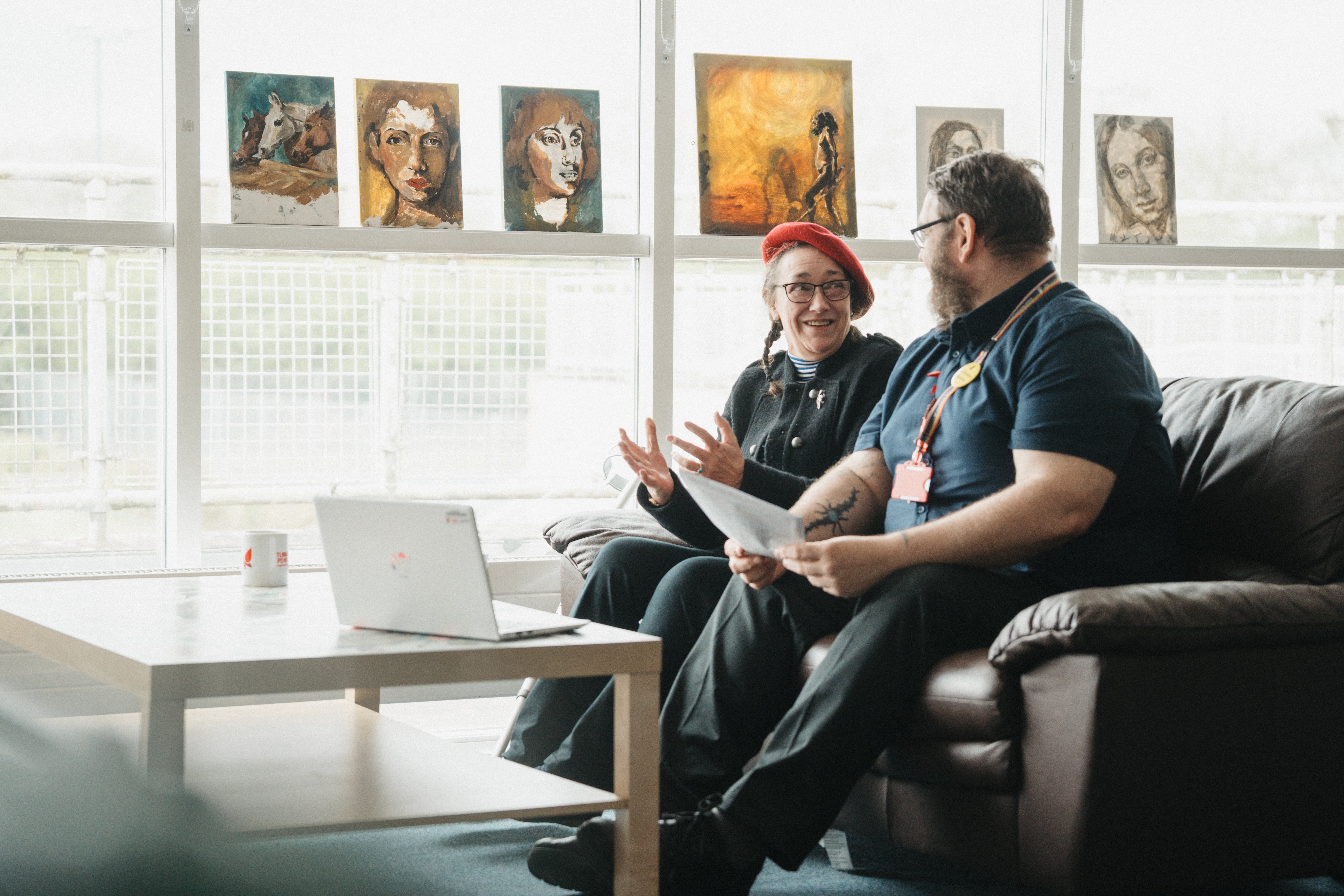 A man and woman sitting on a couch