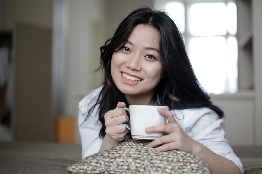 A woman holding a cup
