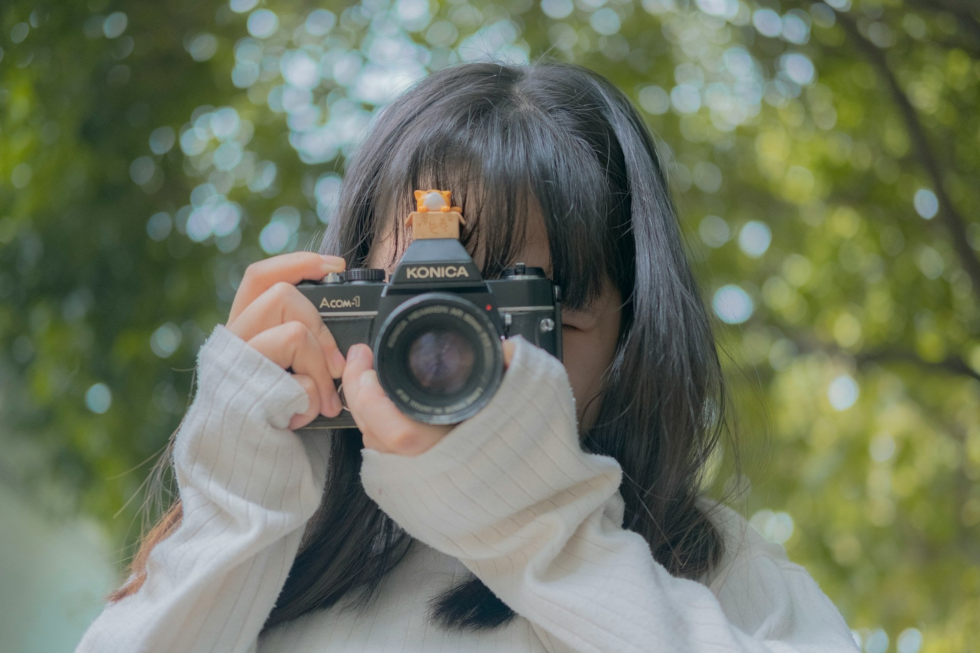 A girl holding a camera