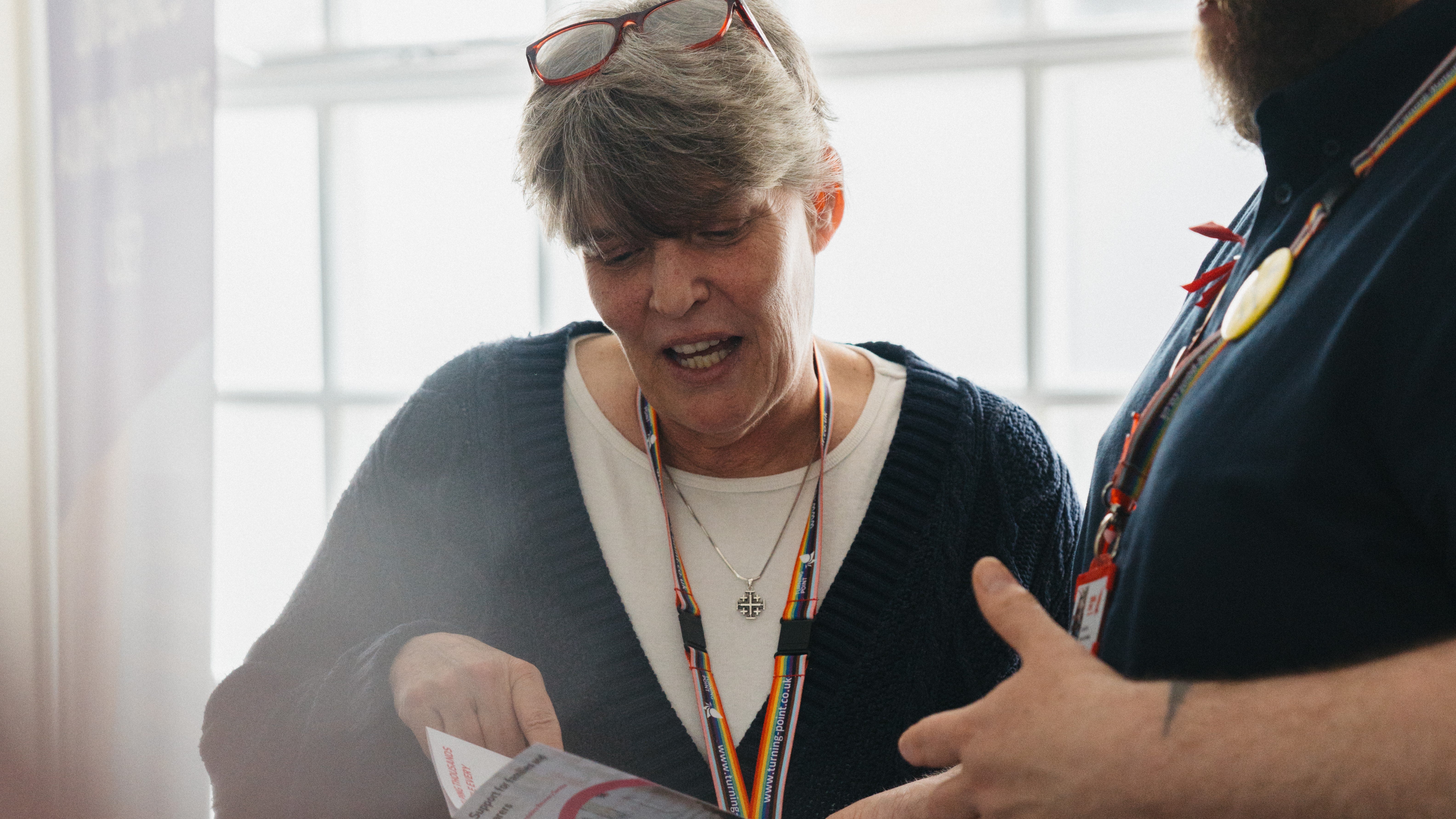 A woman looking at a paper