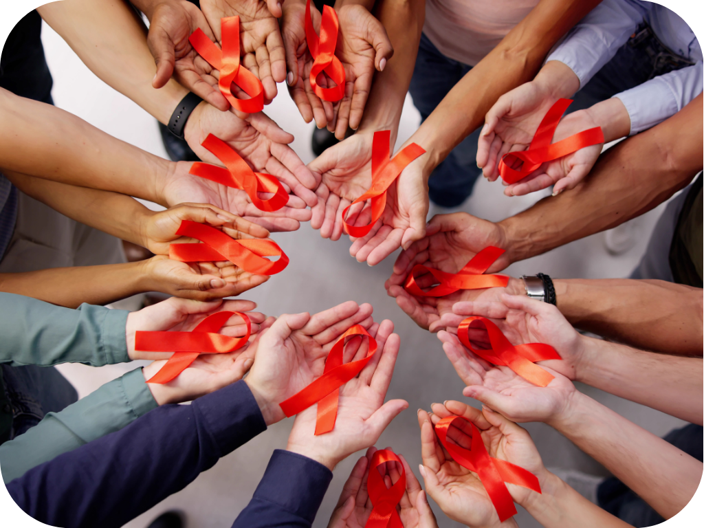 A group of people holding HIV awareness ribbons