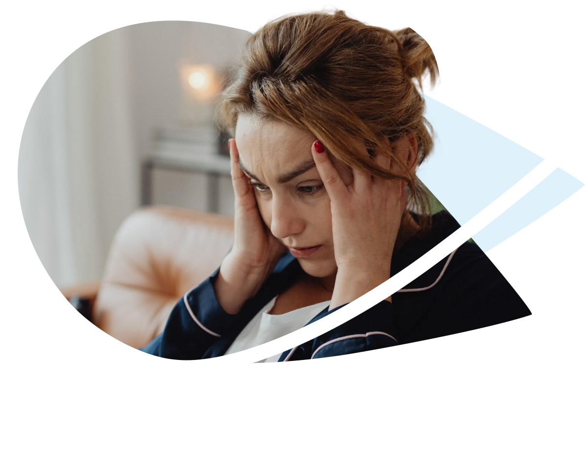 A woman holding her head