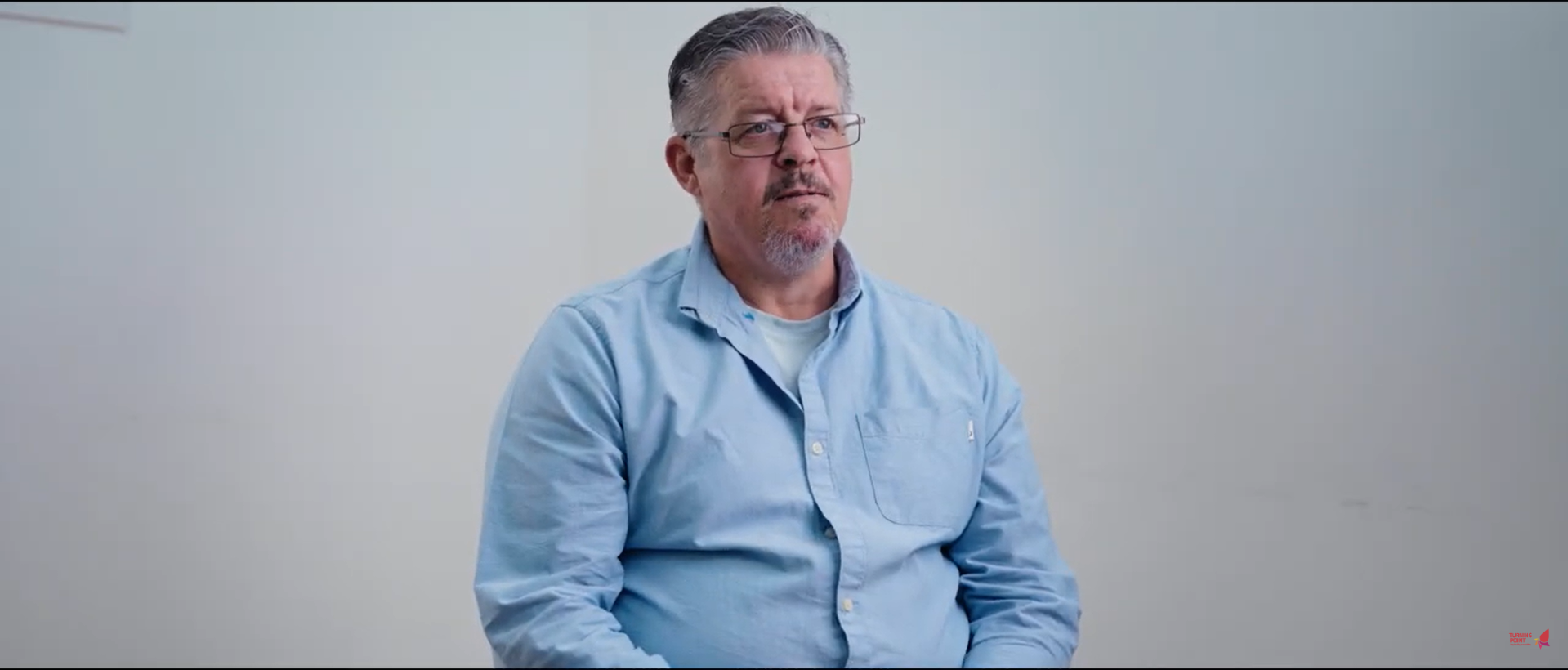 A man in a blue shirt