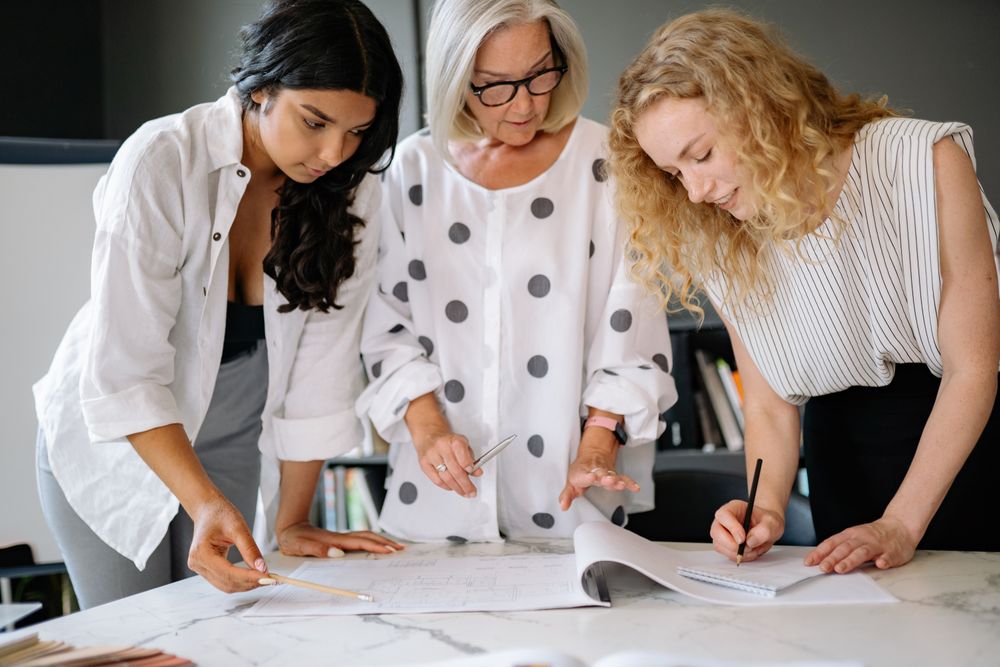 A group of women looking of different ages working together