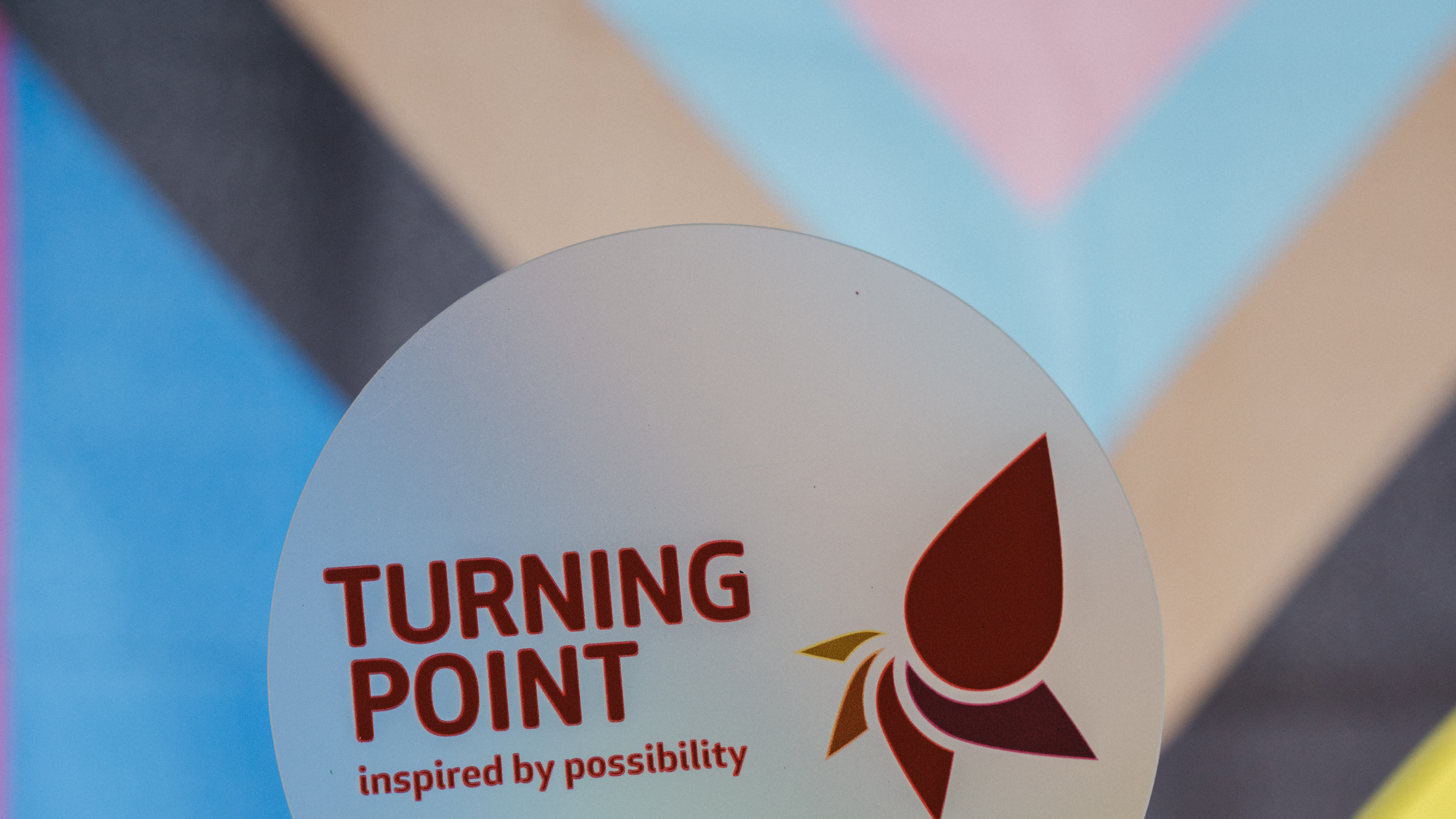 Turning point logo against a window