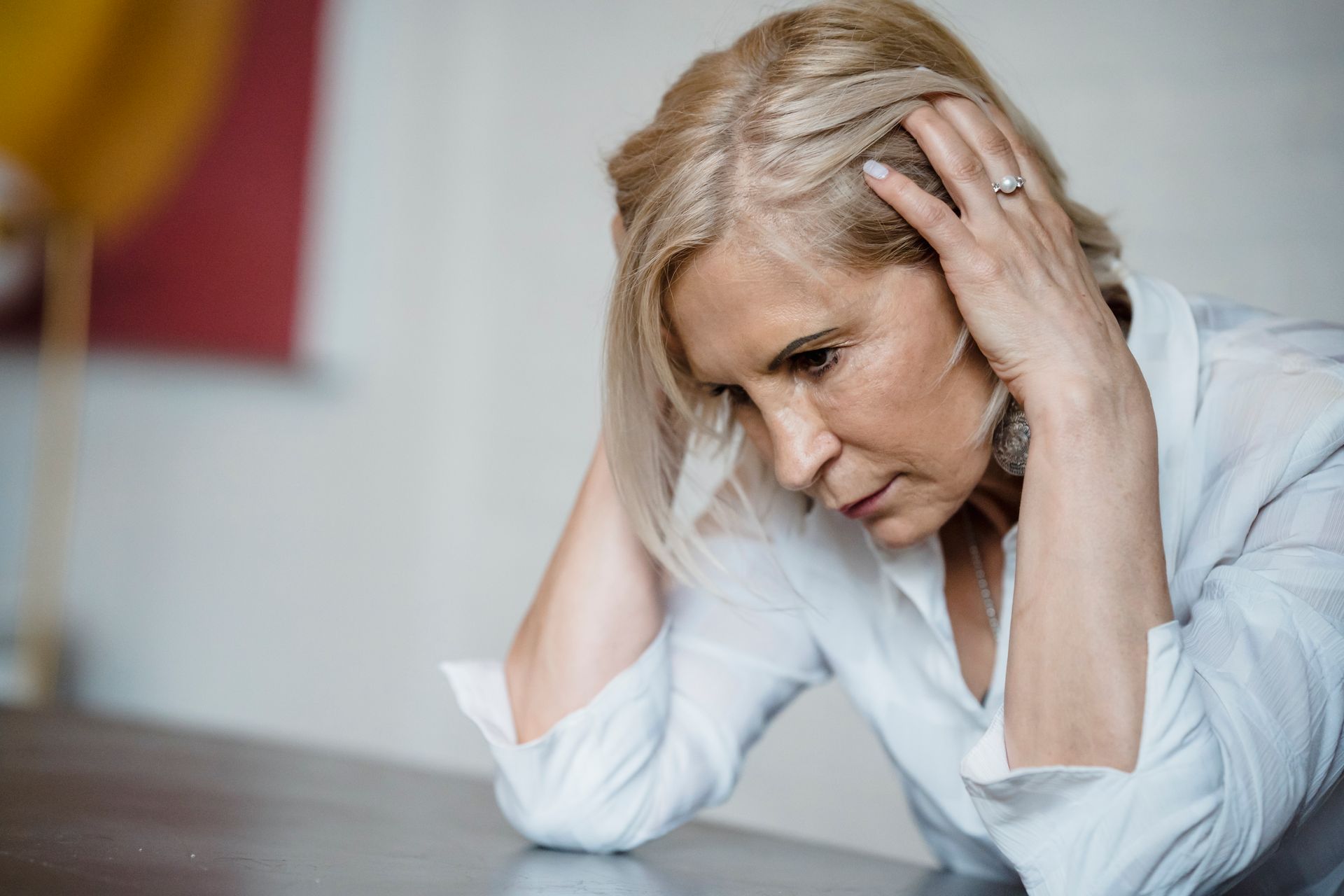 A woman with her hands on her head