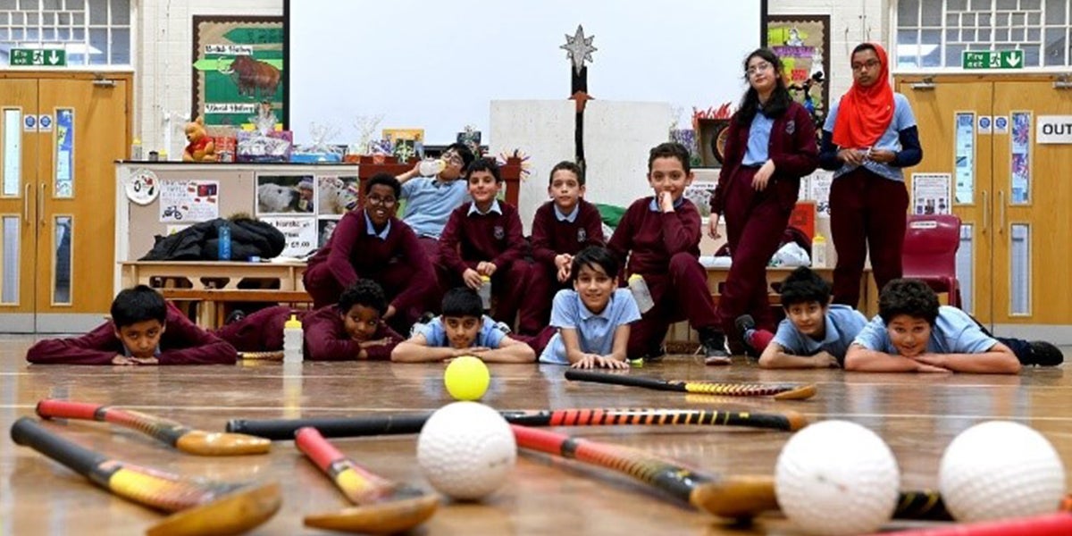 Children in a school enjoying hockey