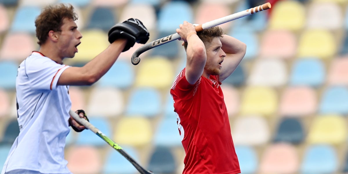 Nick Bandurak holds his head in his hands during the 3-2 defeat to Germany