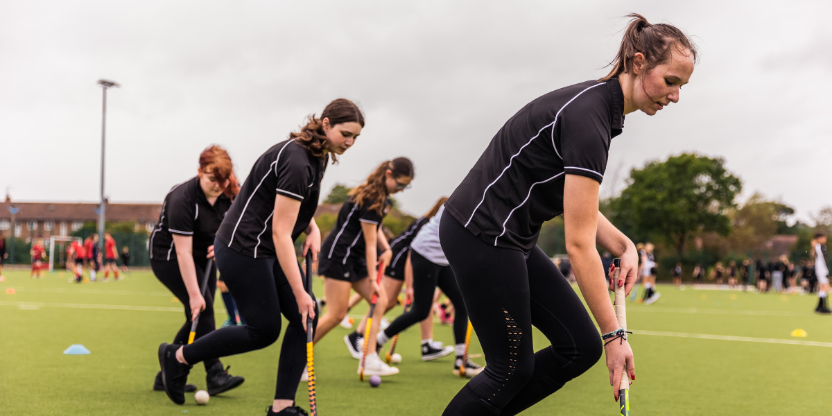 Girls playing hockey