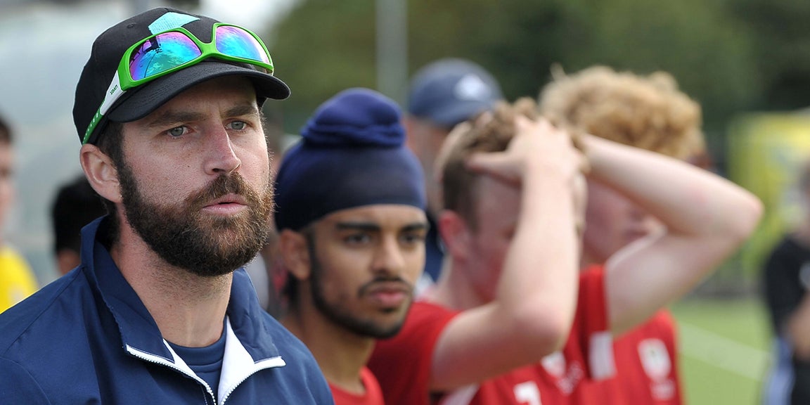 Hockey Coach watching the game 
