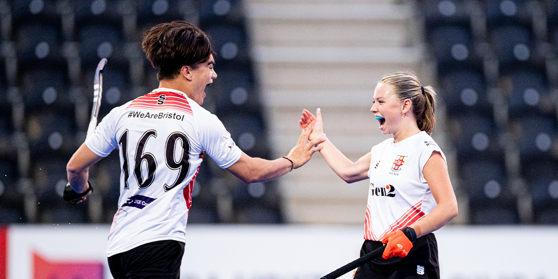 Man and Woman Hockey Player high five