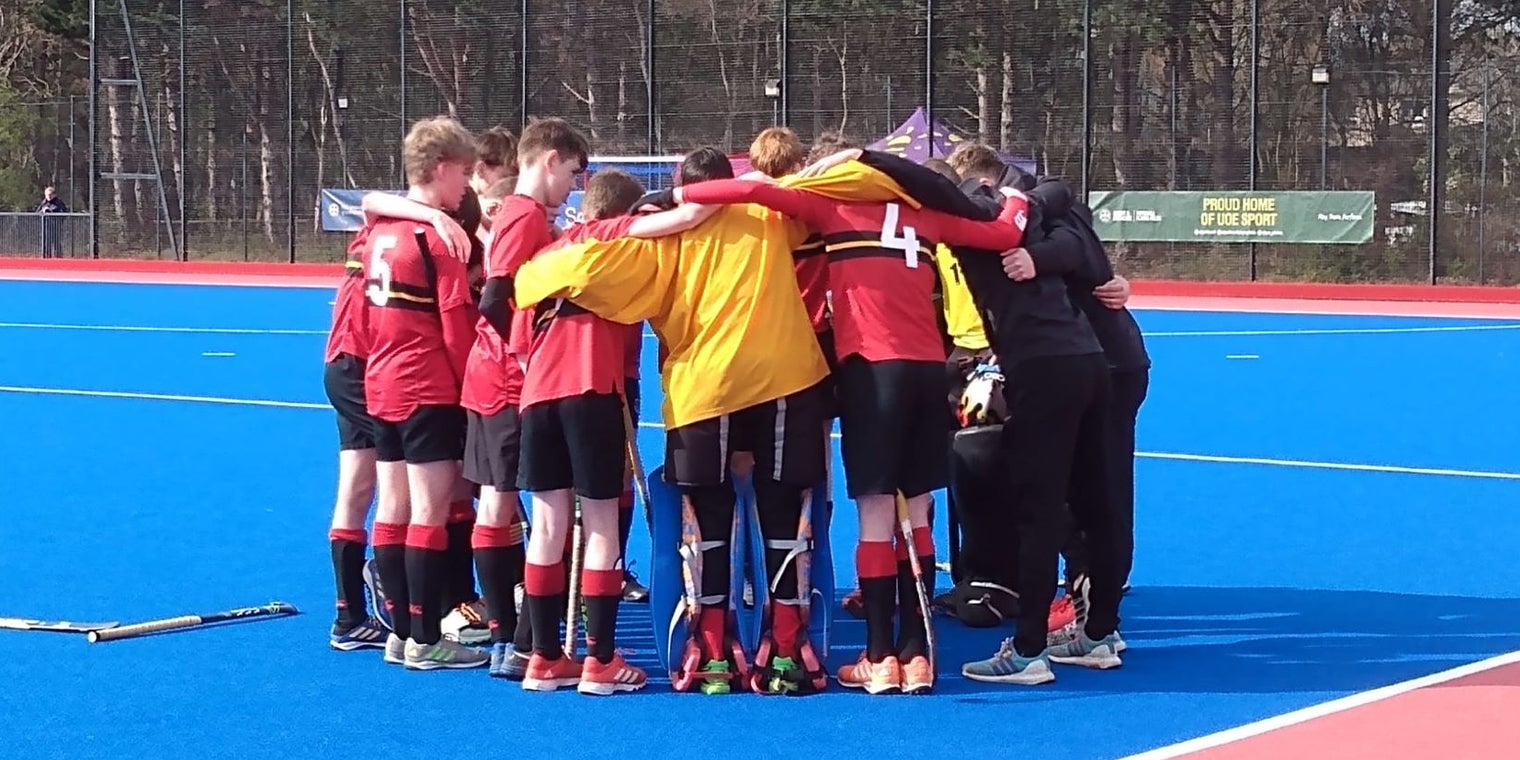 Junior Boys team huddle