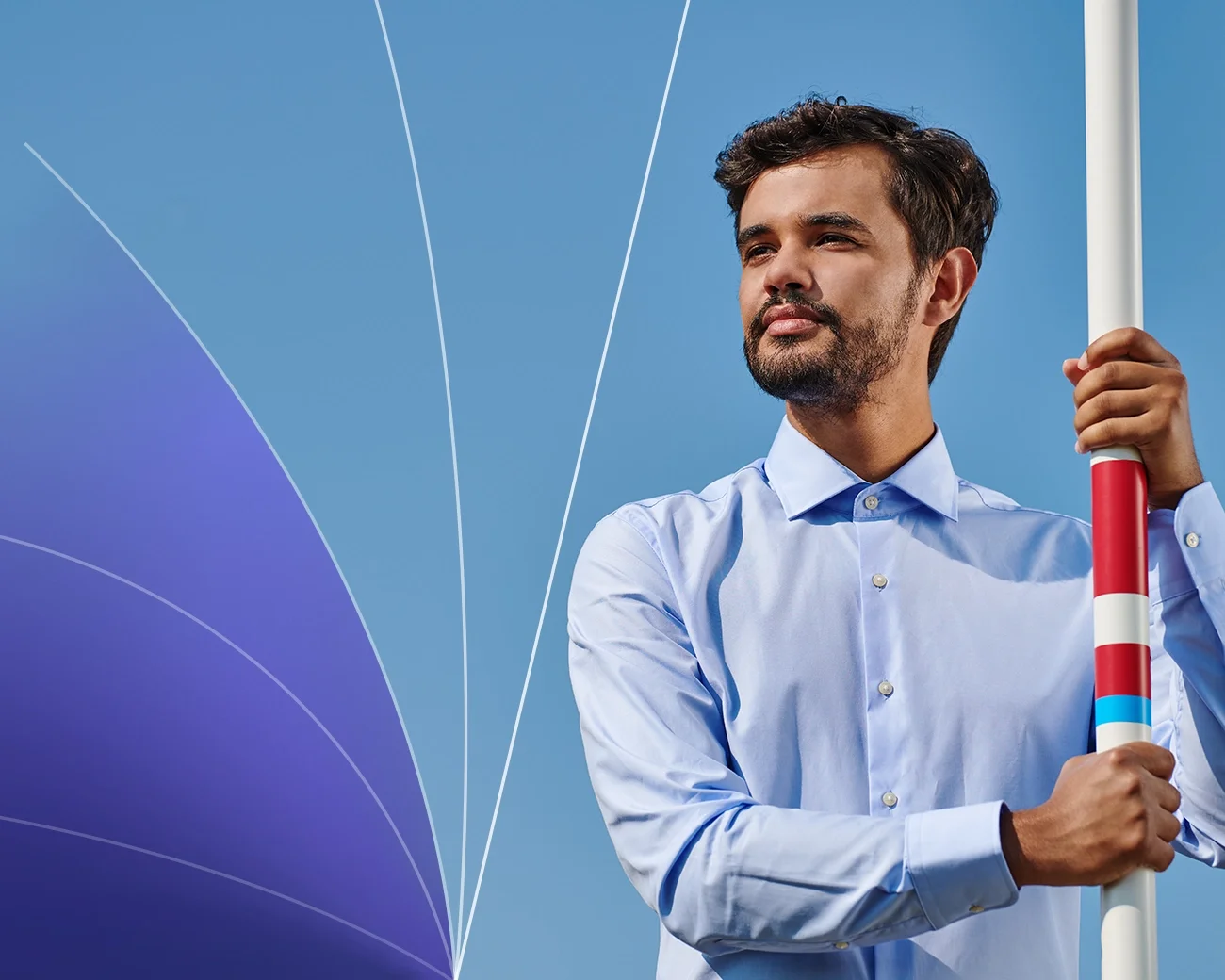 Zakenman met polsstok en ambitielijnen.