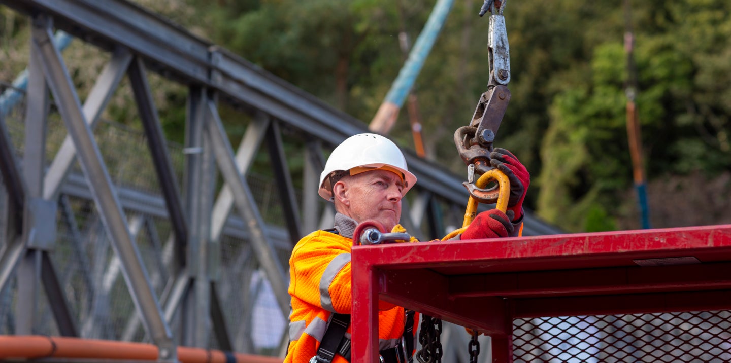 Breaker image showing photograph of Mabey Hire engineer at work