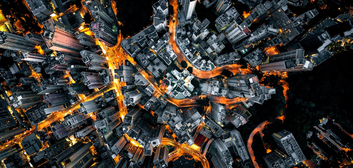 Supporting image showing arial shot of city