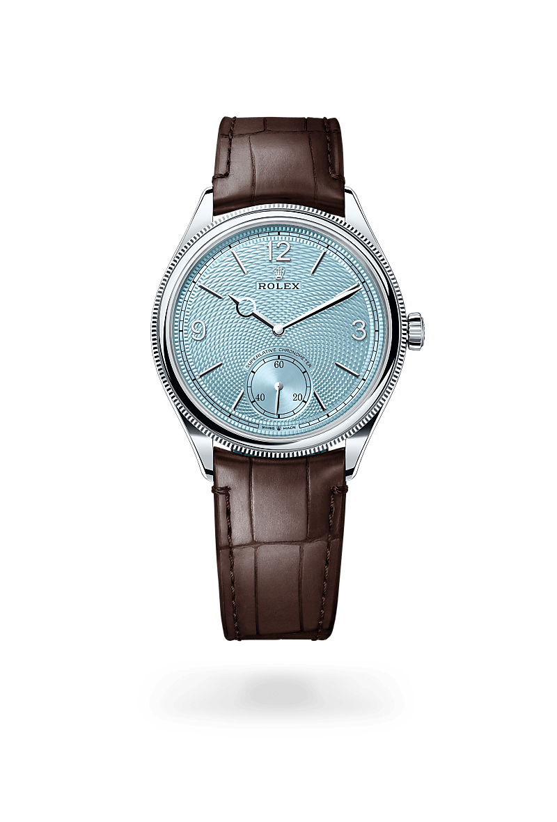 Rolex 1908 in 39 mm, platinum, polished finish with a Ice blue, rice-grain motif dial, Domed and fluted bezel, and Leather strap bracelet