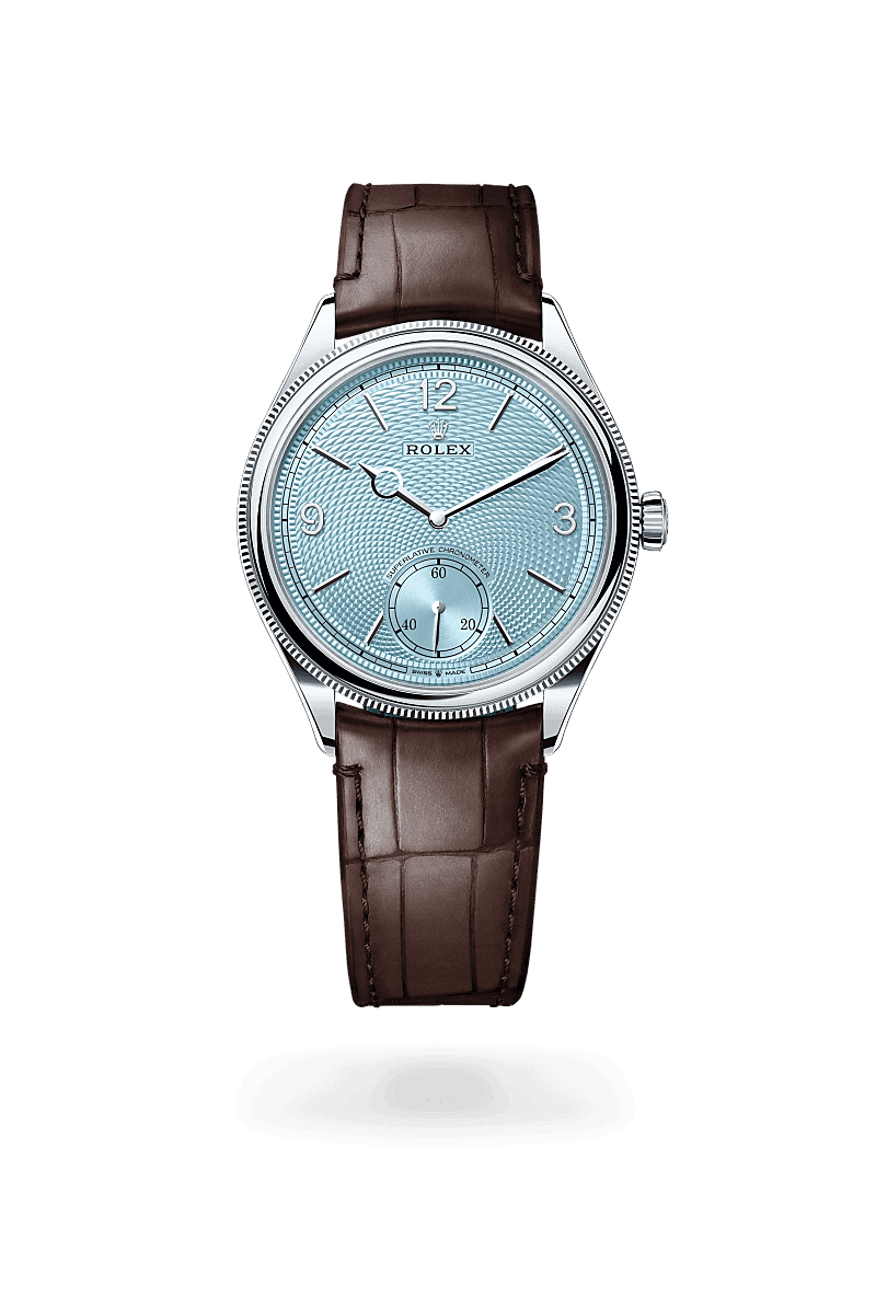 Rolex 1908 in 39 mm, platinum, polished finish with a Ice blue, rice-grain motif dial, Domed and fluted bezel, and Leather strap bracelet