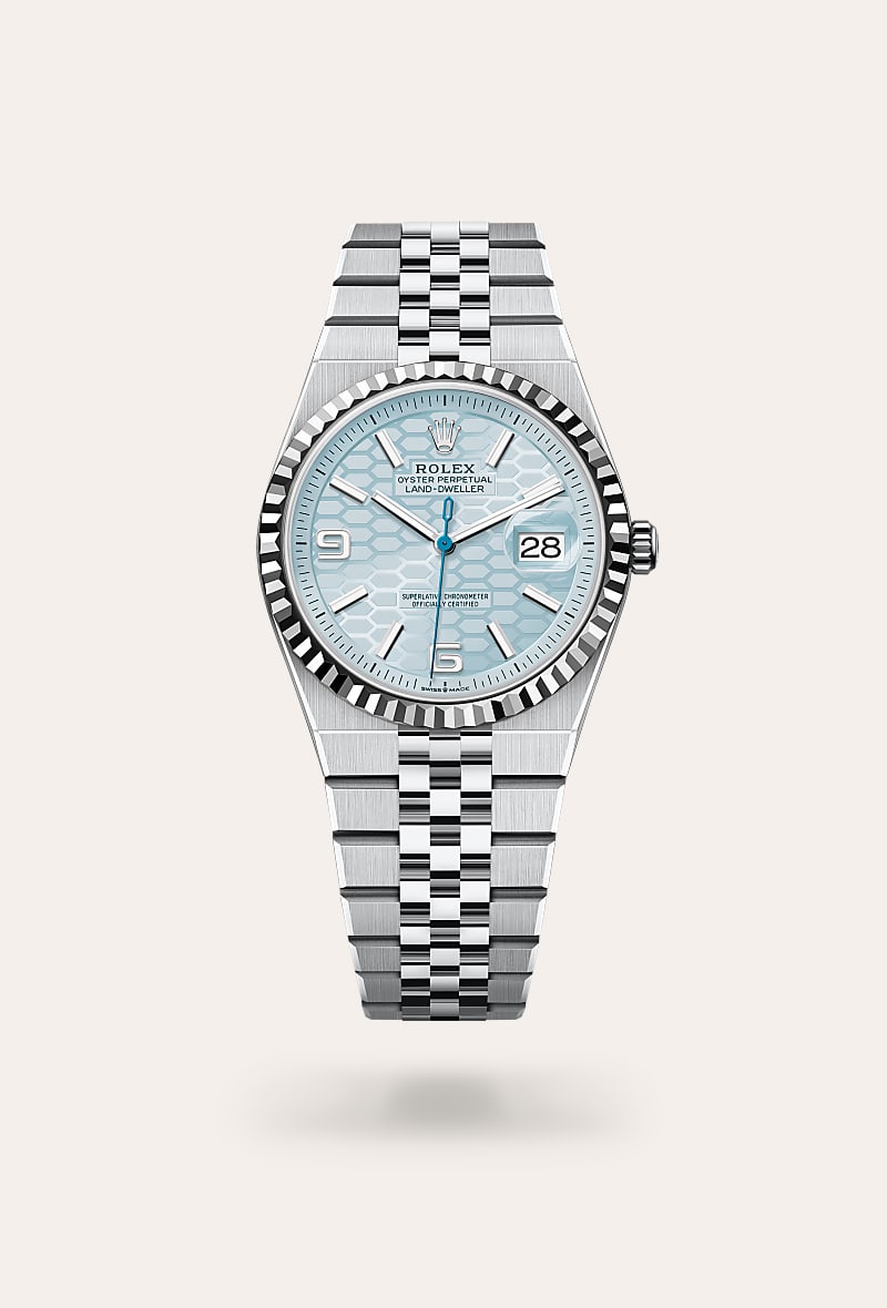 Rolex Land-Dweller 36 in Oyster, 36 mm, platina with a IJsblauw, honingraatmotief dial, Gekarteld bezel, and Platina bracelet