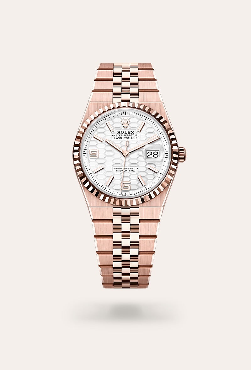 Rolex Land-Dweller 36 in Oyster, 36 mm, Everose-goud with a Hagelwit, honingraatmotief dial, Gekarteld bezel, and Flat Jubilee, vijfdelige massieve schakels bracelet