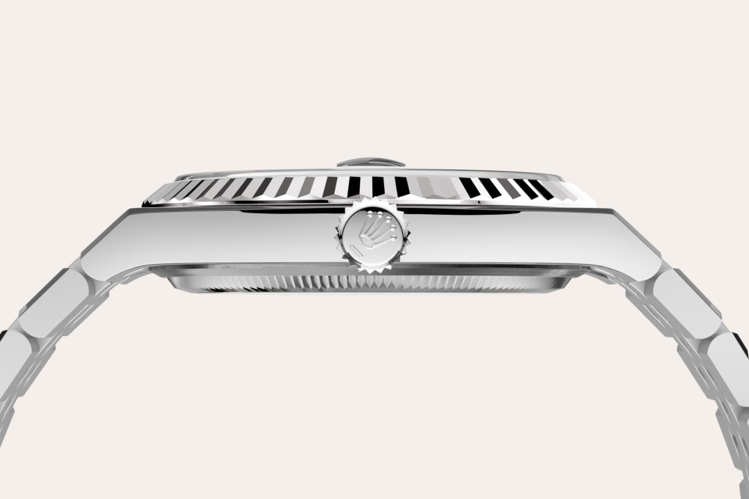 Rolex Land-Dweller 40 in Oyster, 40 mm, Oystersteel and white gold with a Intense white, honeycomb motif dial, Fluted bezel, and Flat Jubilee, five-piece solid links bracelet