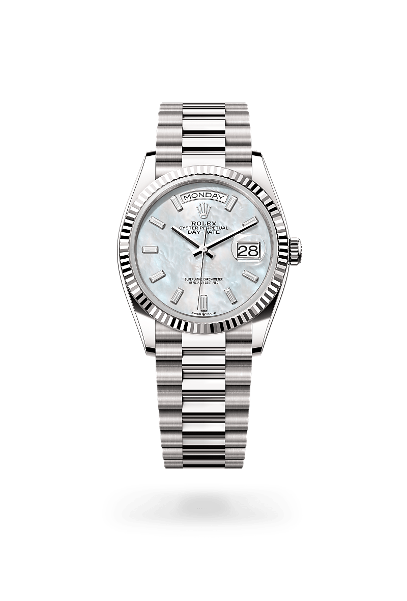Rolex Day-Date 36 in Oyster, 36 mm, white gold with a White mother-of-pearl set with diamonds dial, Fluted bezel, and President, semi-circular three-piece links bracelet